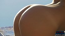 Playboy babe strips off her tiny bikini near a pool